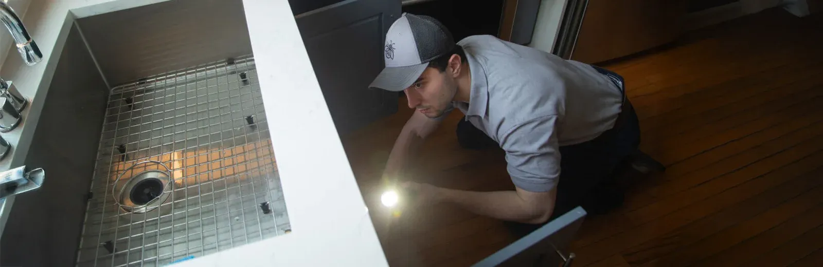inspecting kitchen cabinet