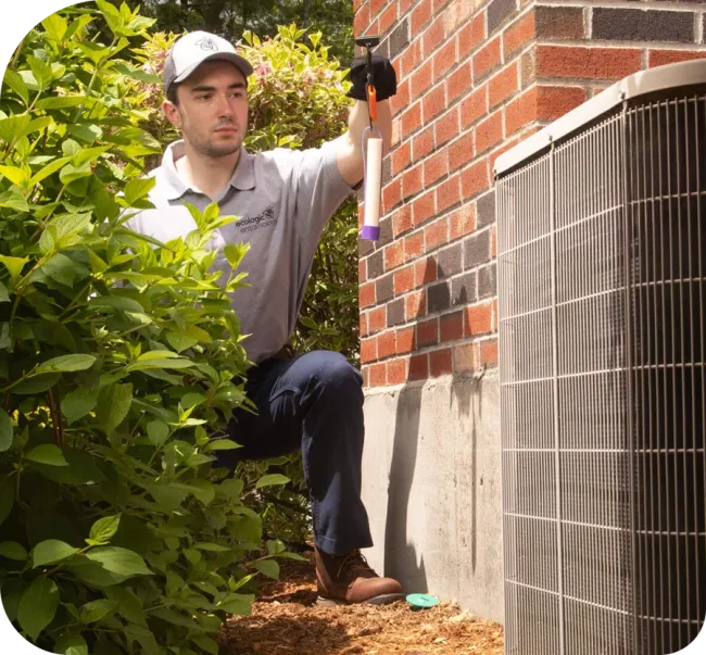 pest control technician checking termite bait