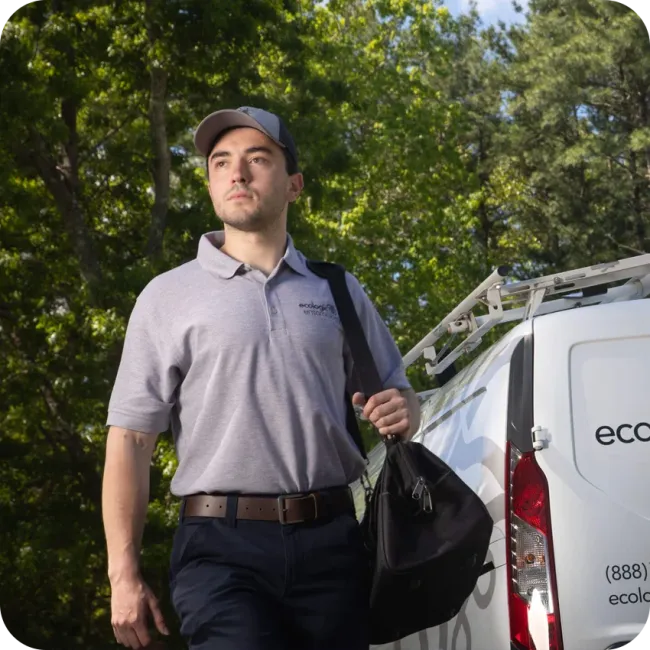technician standing next to van