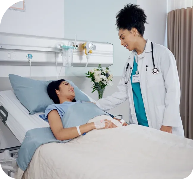 dr speaking to patient in hospital room