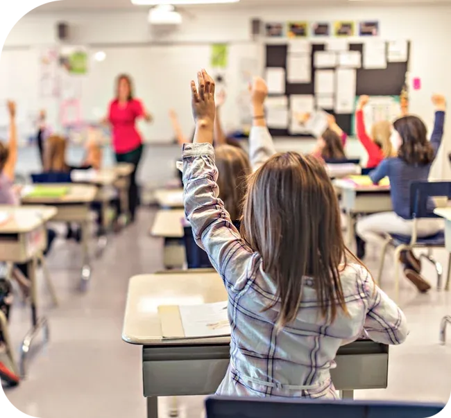 student raising hand in classroom